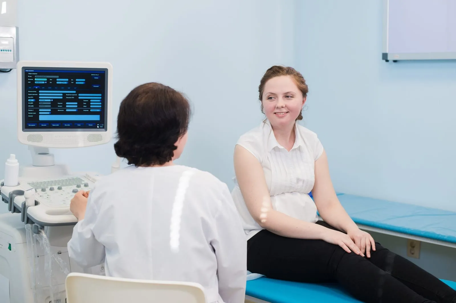 A doctor talking with a patient during a consultation